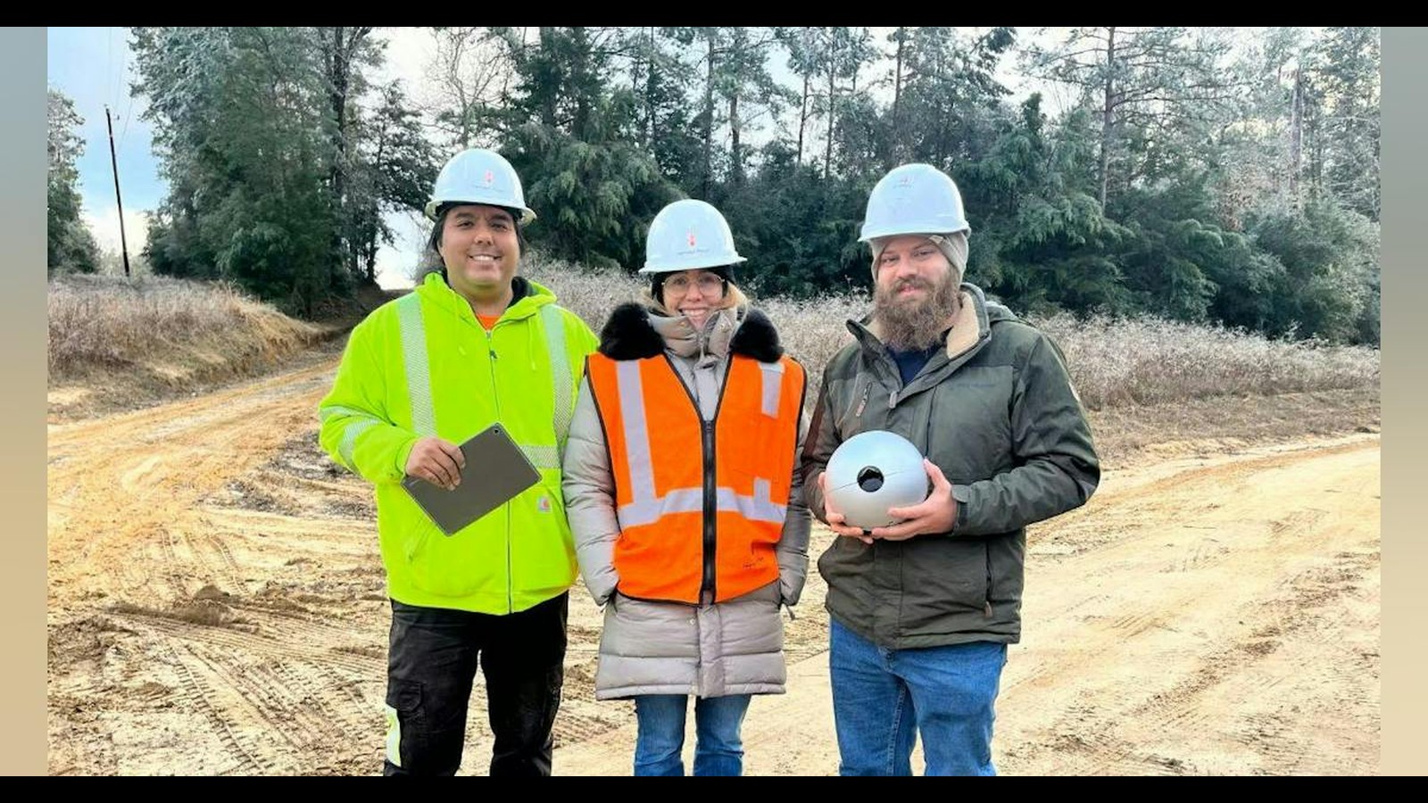 Entergy and Heimdall Power crew with a line sensor on site